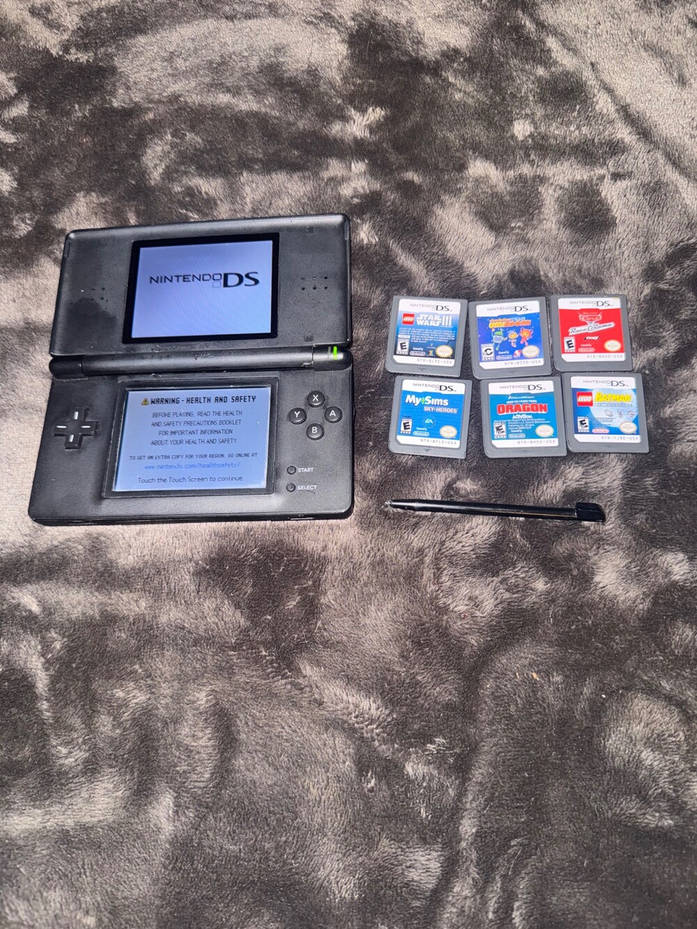 Nintendo DS Lite Handheld Gaming Console with 6 games and safety carrying case